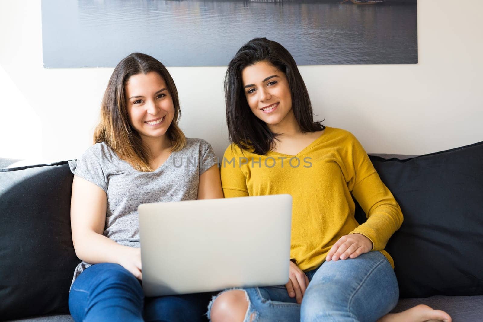 Beautiful young women at home studying for the final exams