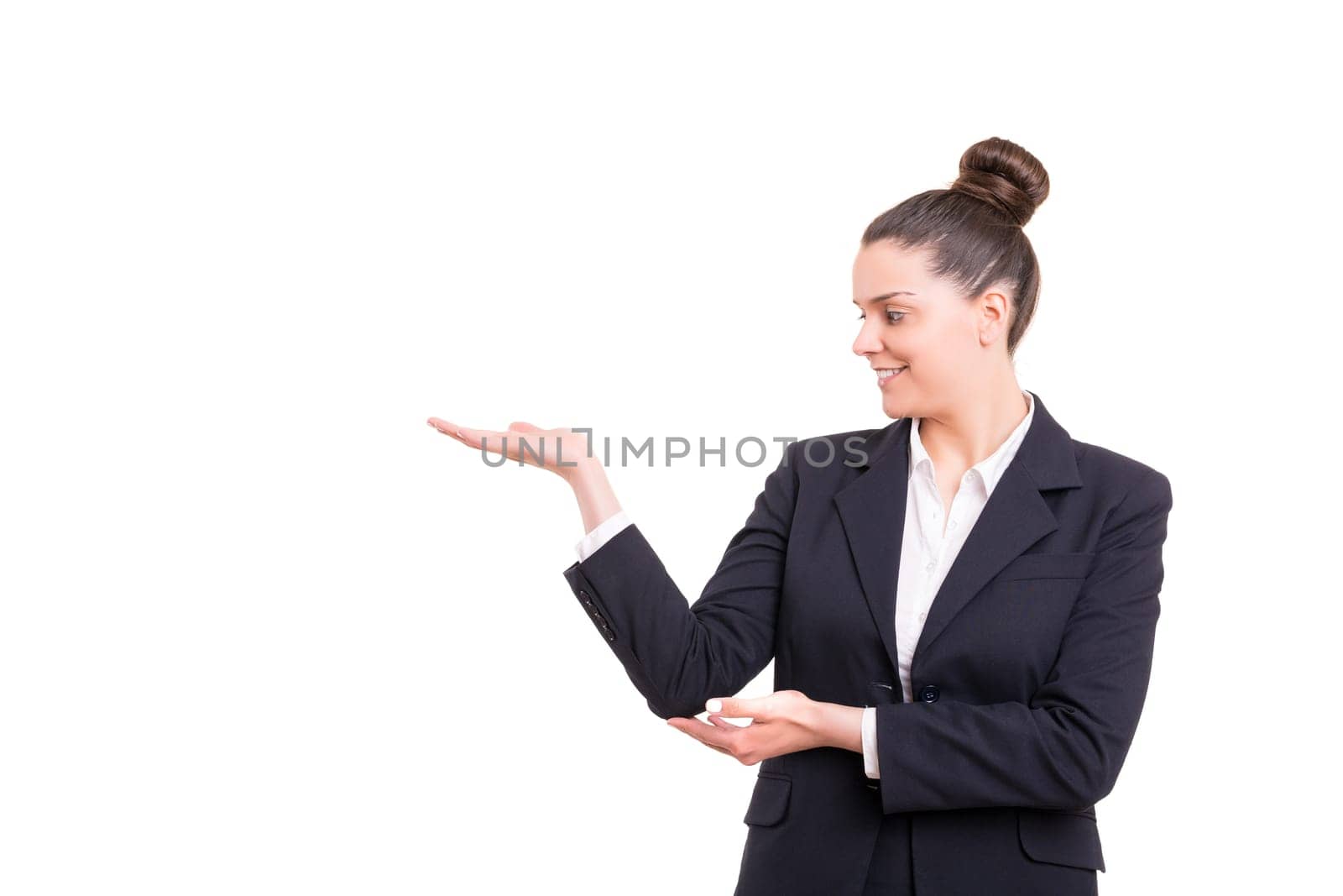 Young beautiful woman presenting your product, isolated over white background