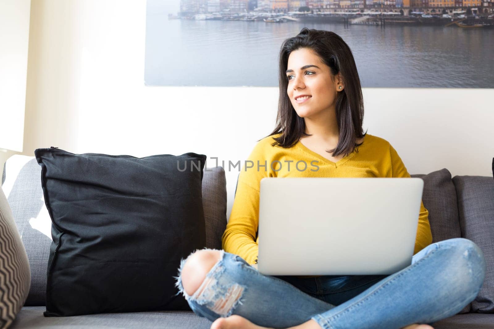 Beautiful woman relaxing with a computer