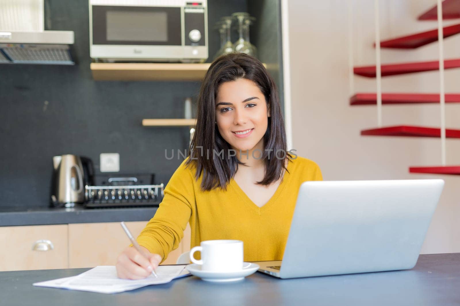 Young woman working at home in the morning