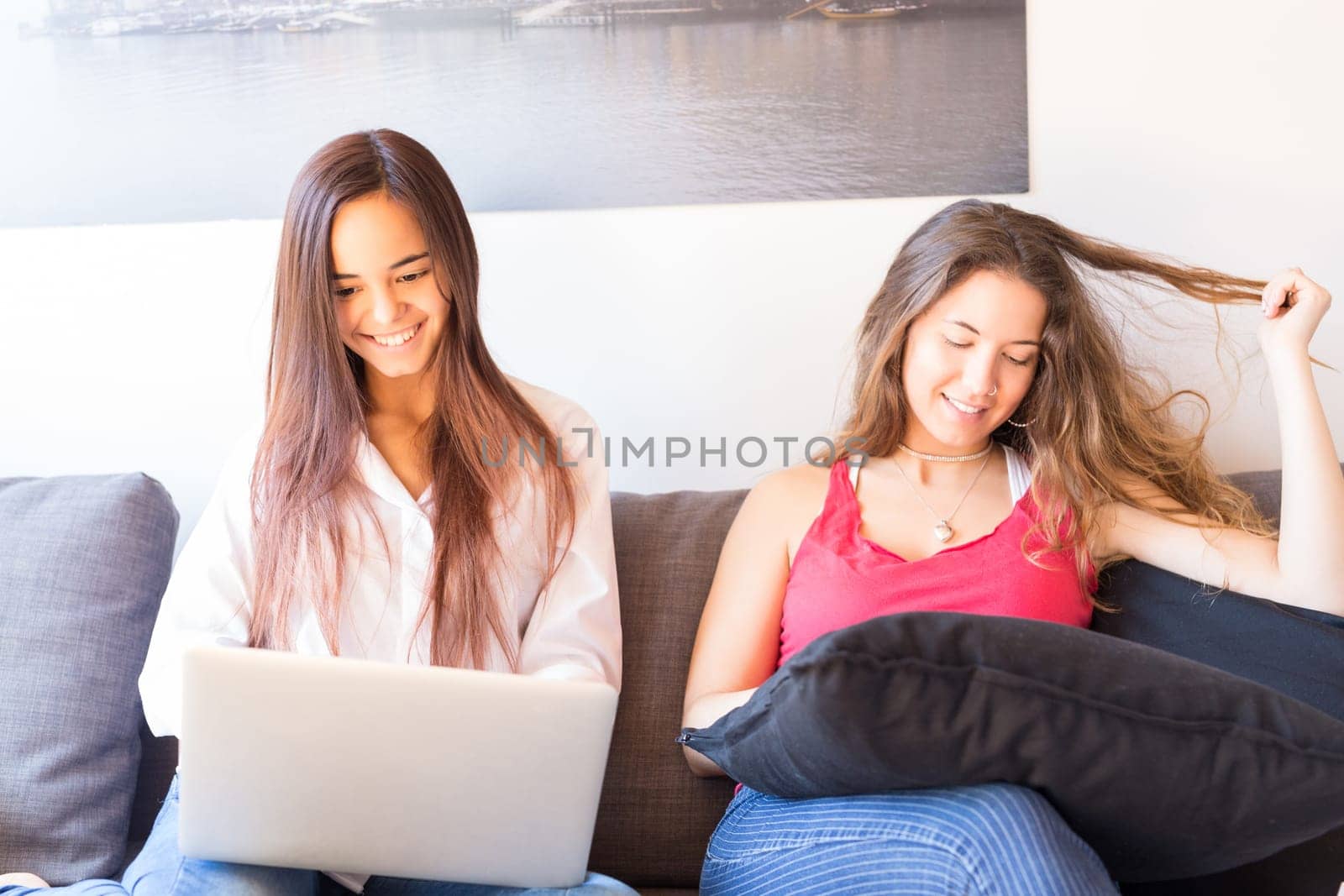 Beautiful young women at home studying for the final exams