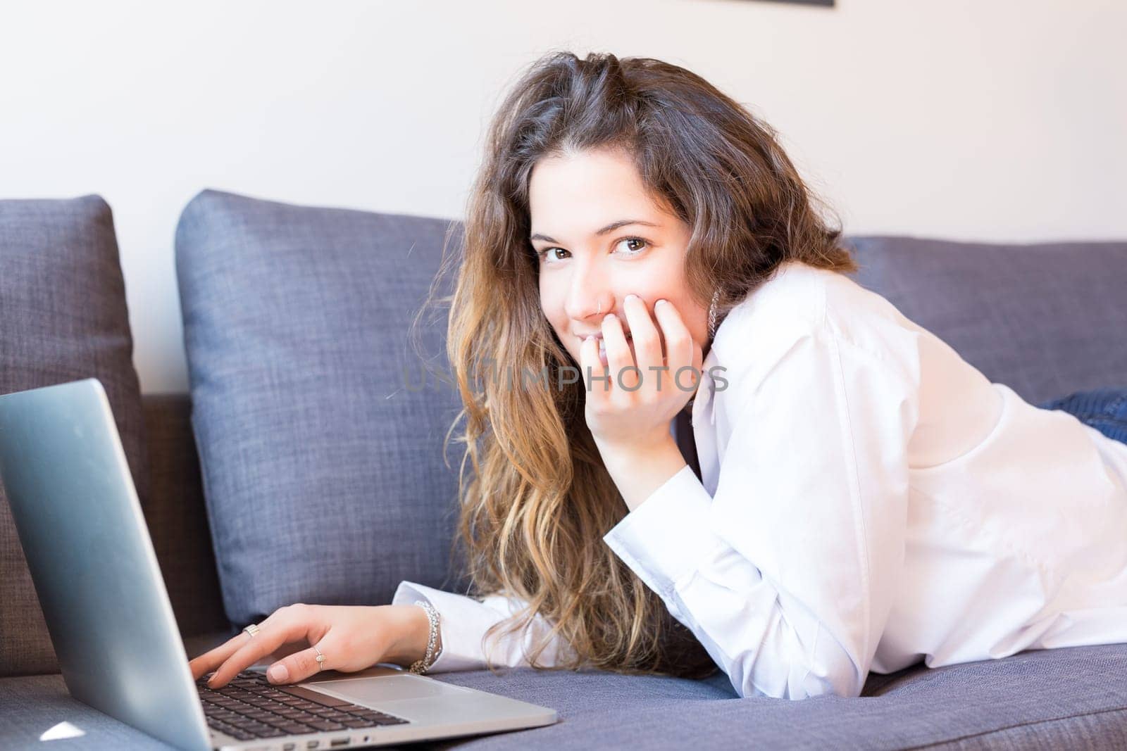 Beautiful woman relaxing with a computer