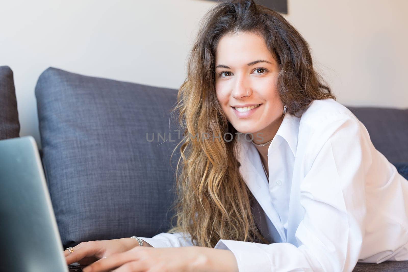 Beautiful woman relaxing with a computer