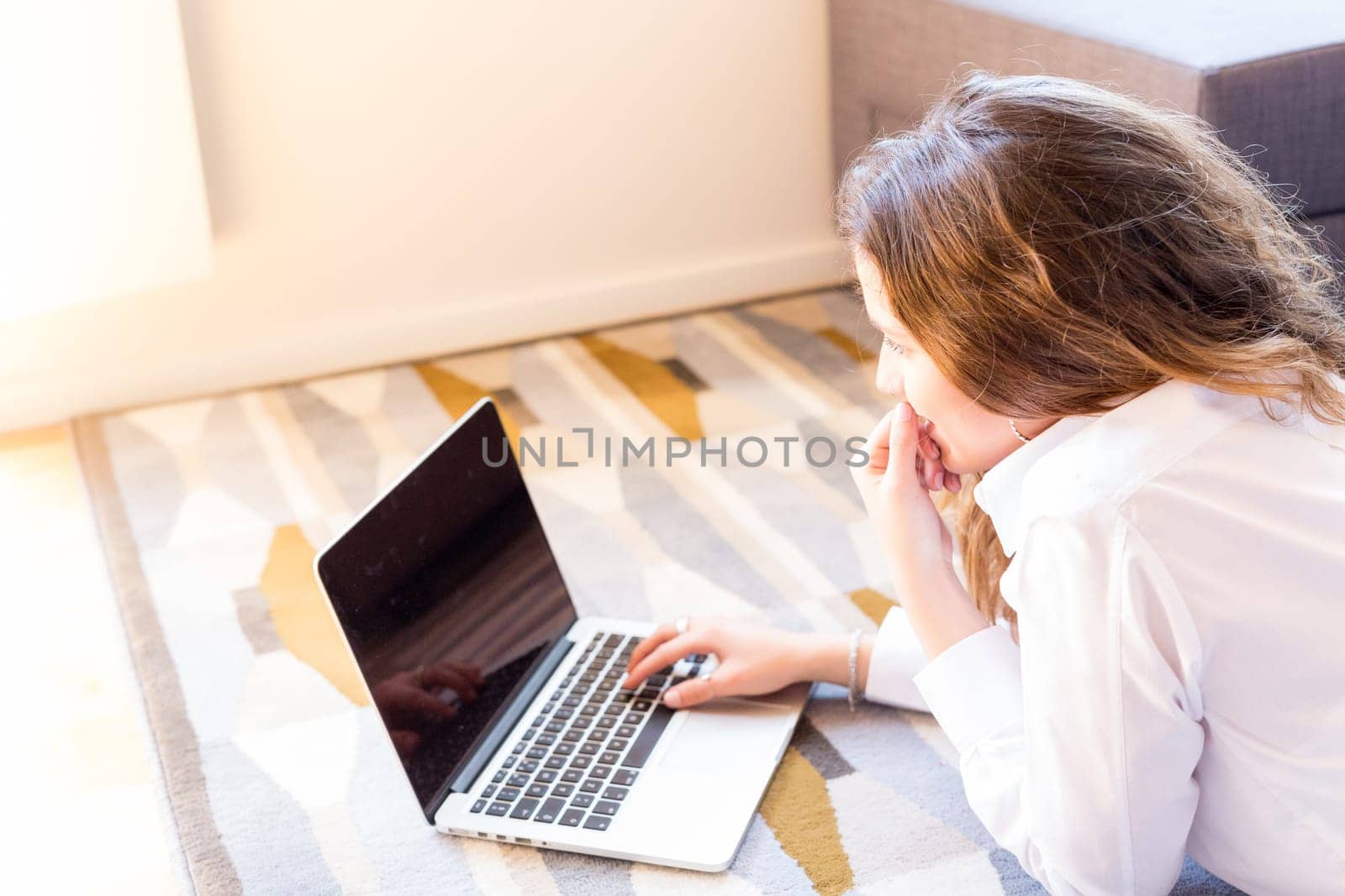 Beautiful woman relaxing with a computer
