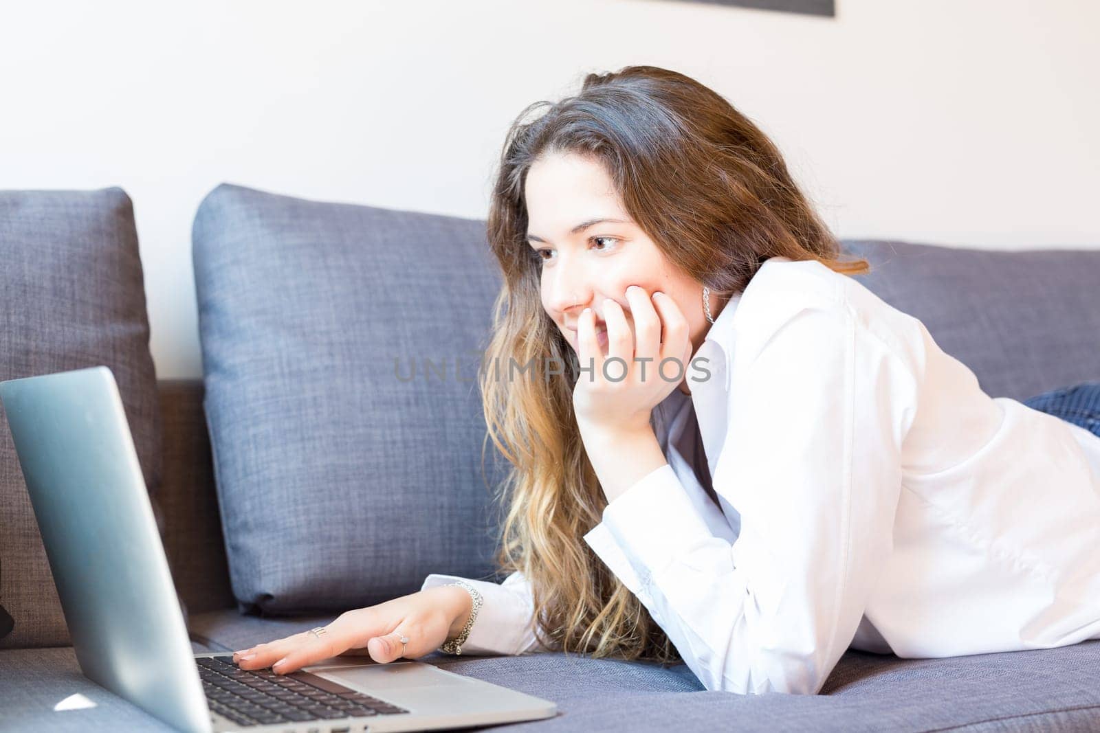 Beautiful woman relaxing with a computer