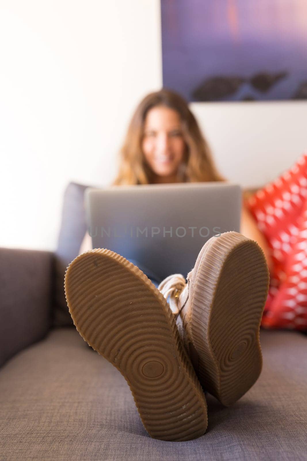 Beautiful woman relaxing with a computer