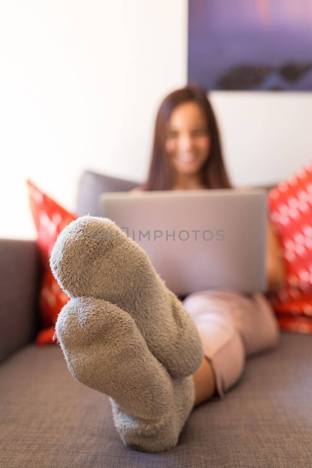Beautiful woman relaxing with a computer