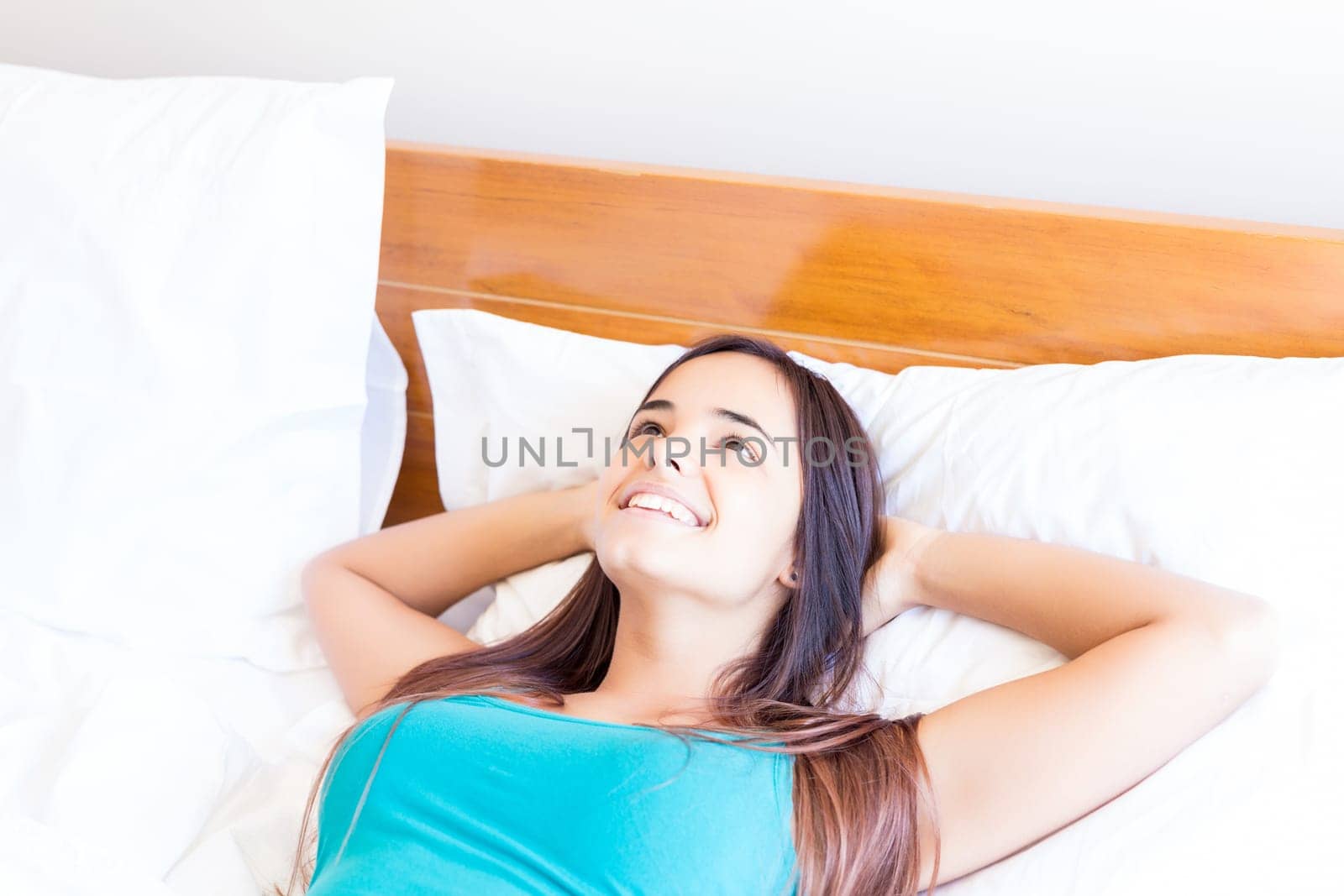 Happy young woman relaxing in the morning