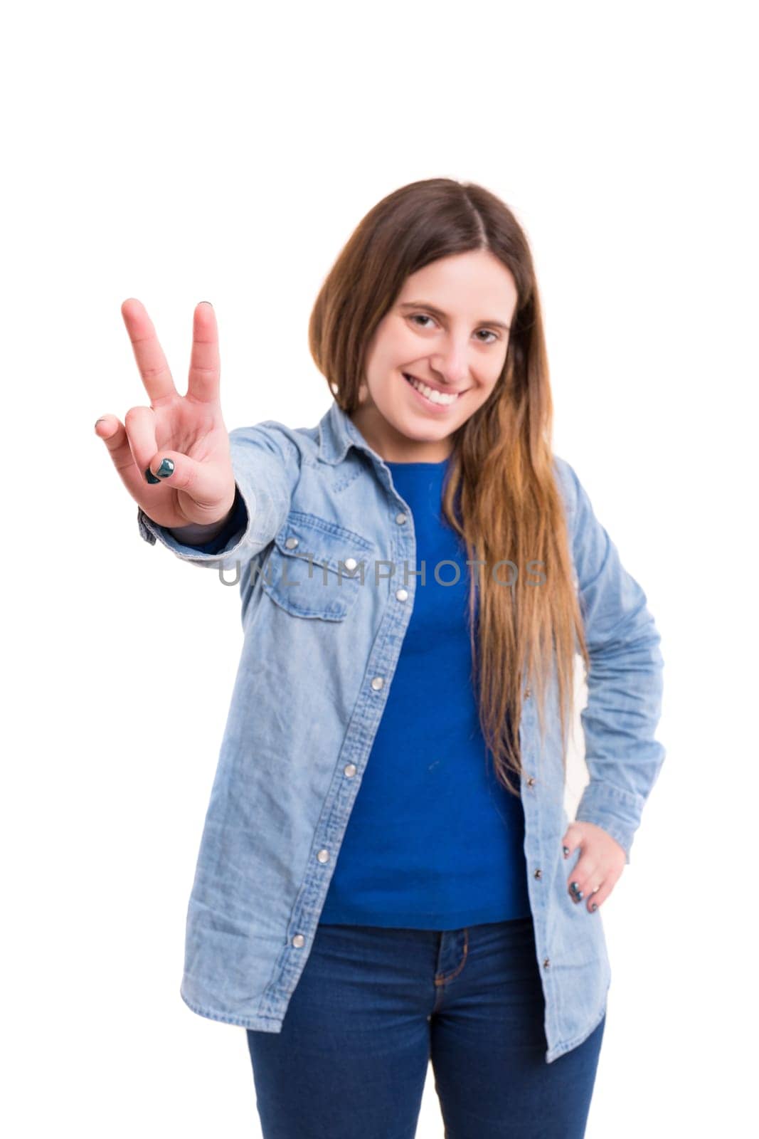 Very beautiful young woman signaling ok, isolated over white