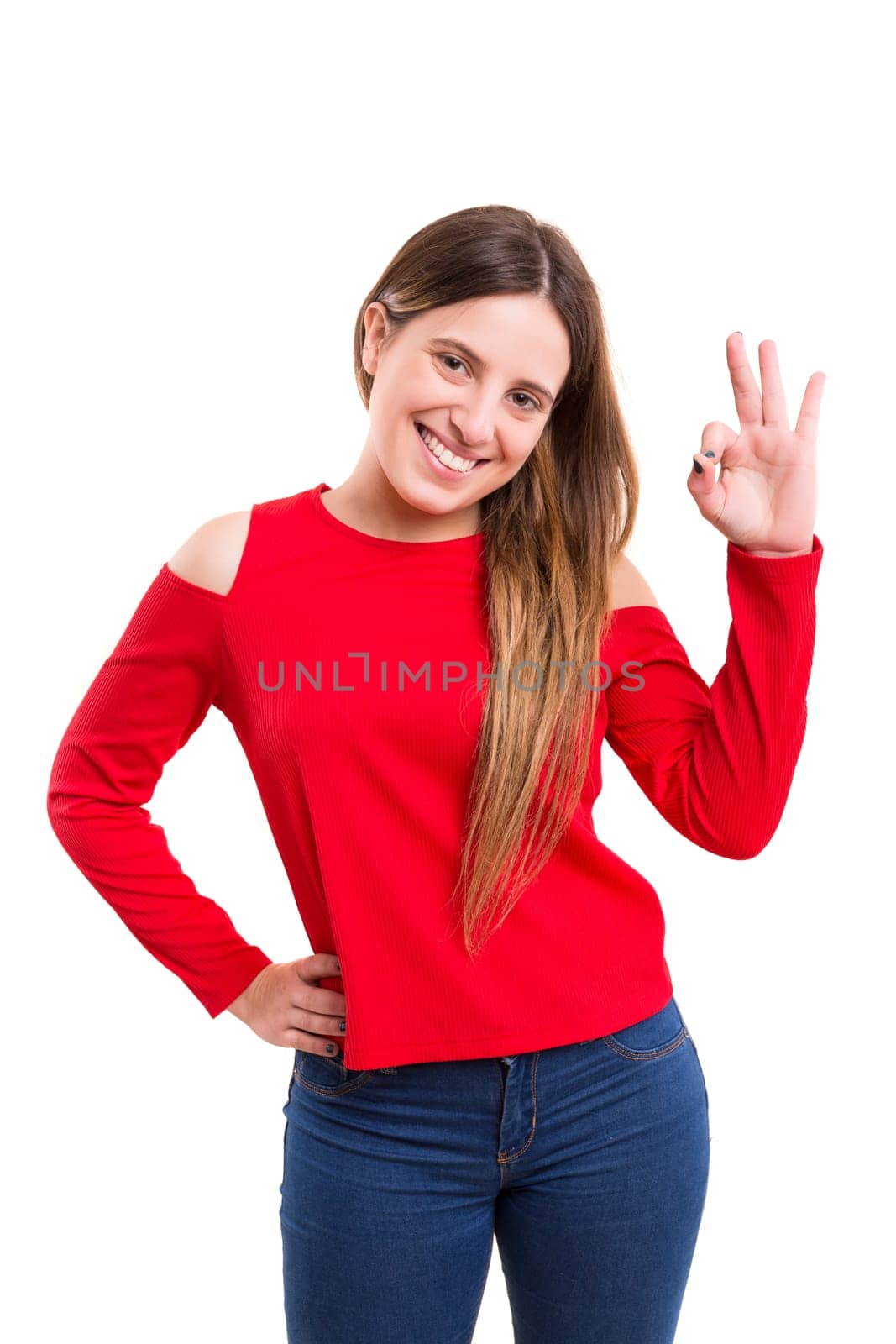 Very beautiful young woman signaling ok, isolated over white