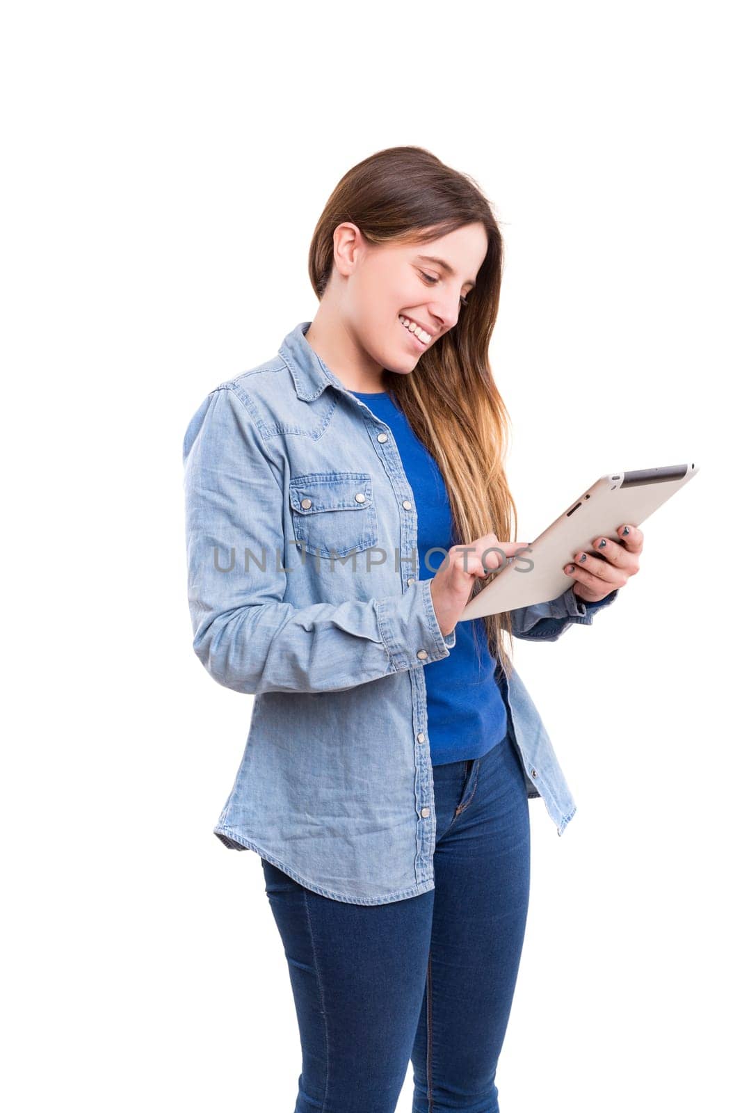 Beautiful woman relaxing with a tablet computer