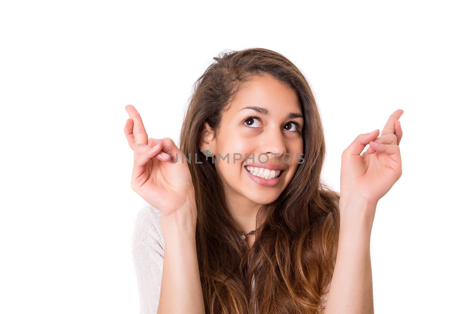 Woman with crossed fingers, isolated over a white background