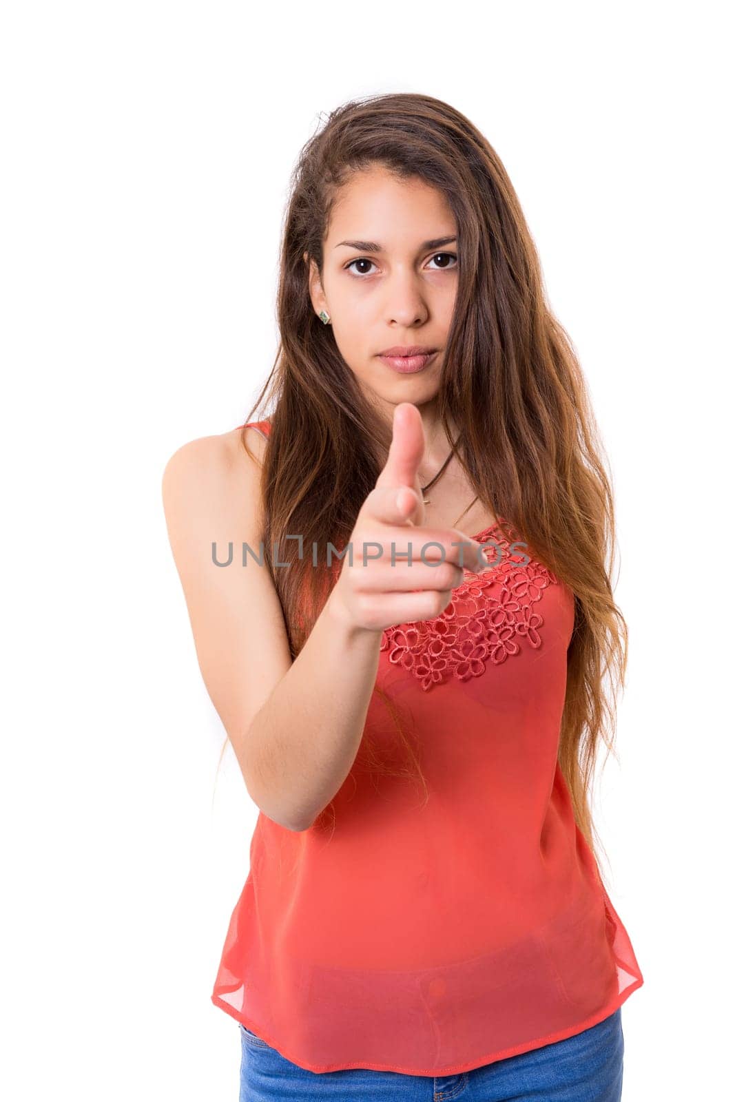 Young beautiful woman pointing at you, isolated over white