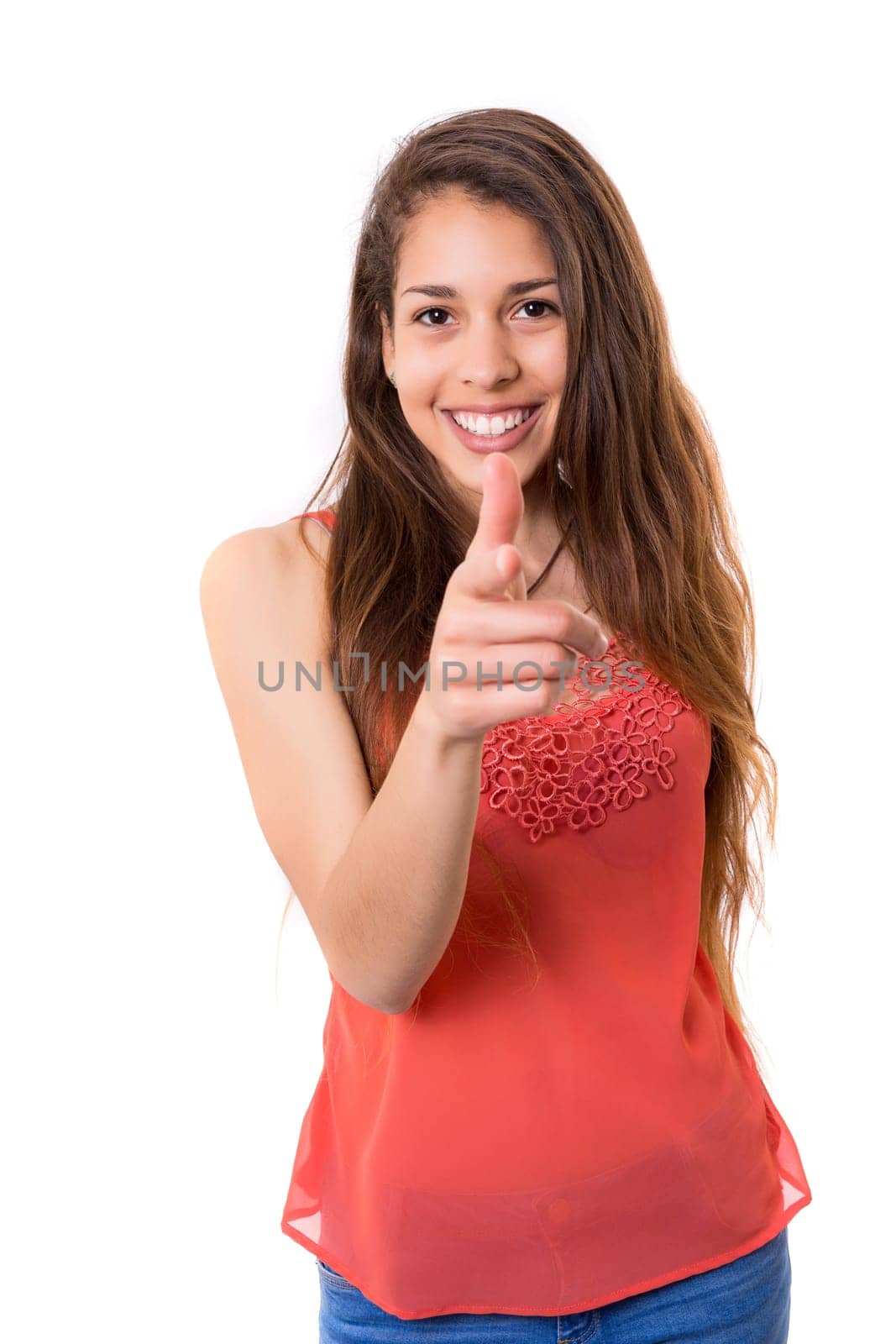 Young beautiful woman pointing at you, isolated over white