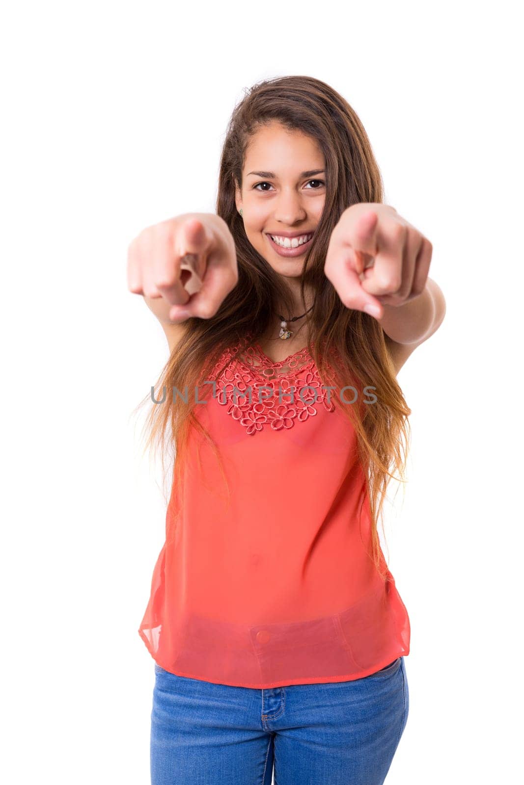 Young beautiful woman pointing at you, isolated over white