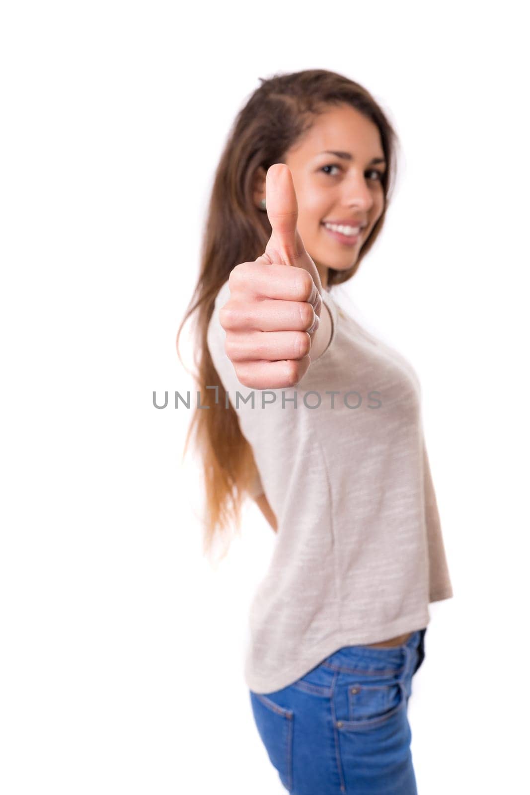 Beautiful young woman signaling ok, isolated over white