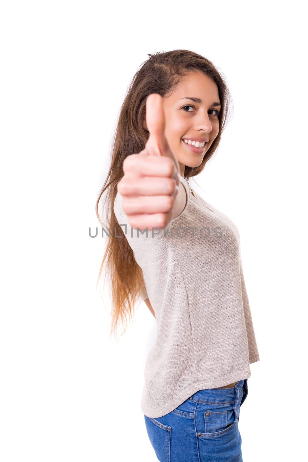 Beautiful young woman signaling ok, isolated over white