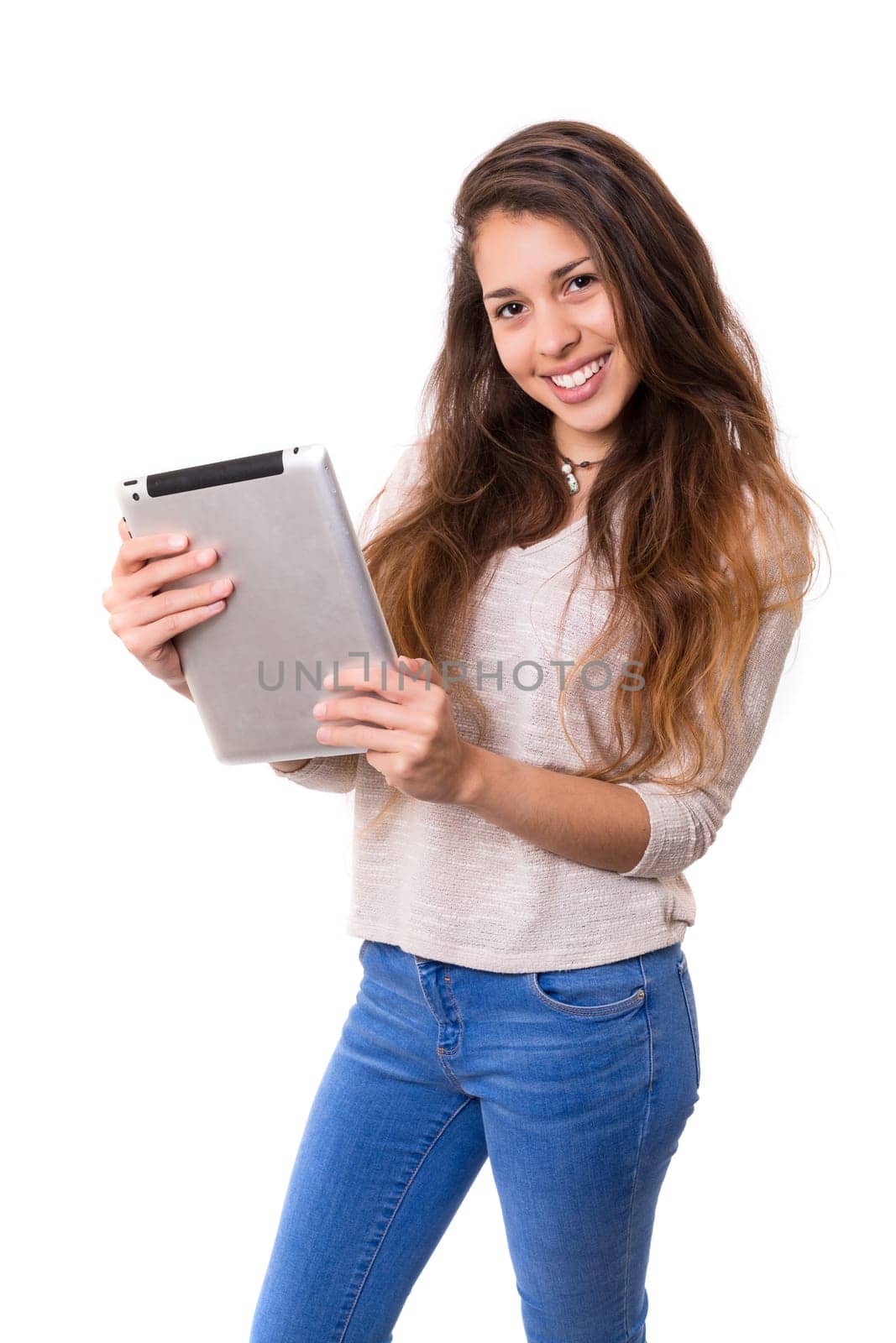 Beautiful woman relaxing with a tablet computer
