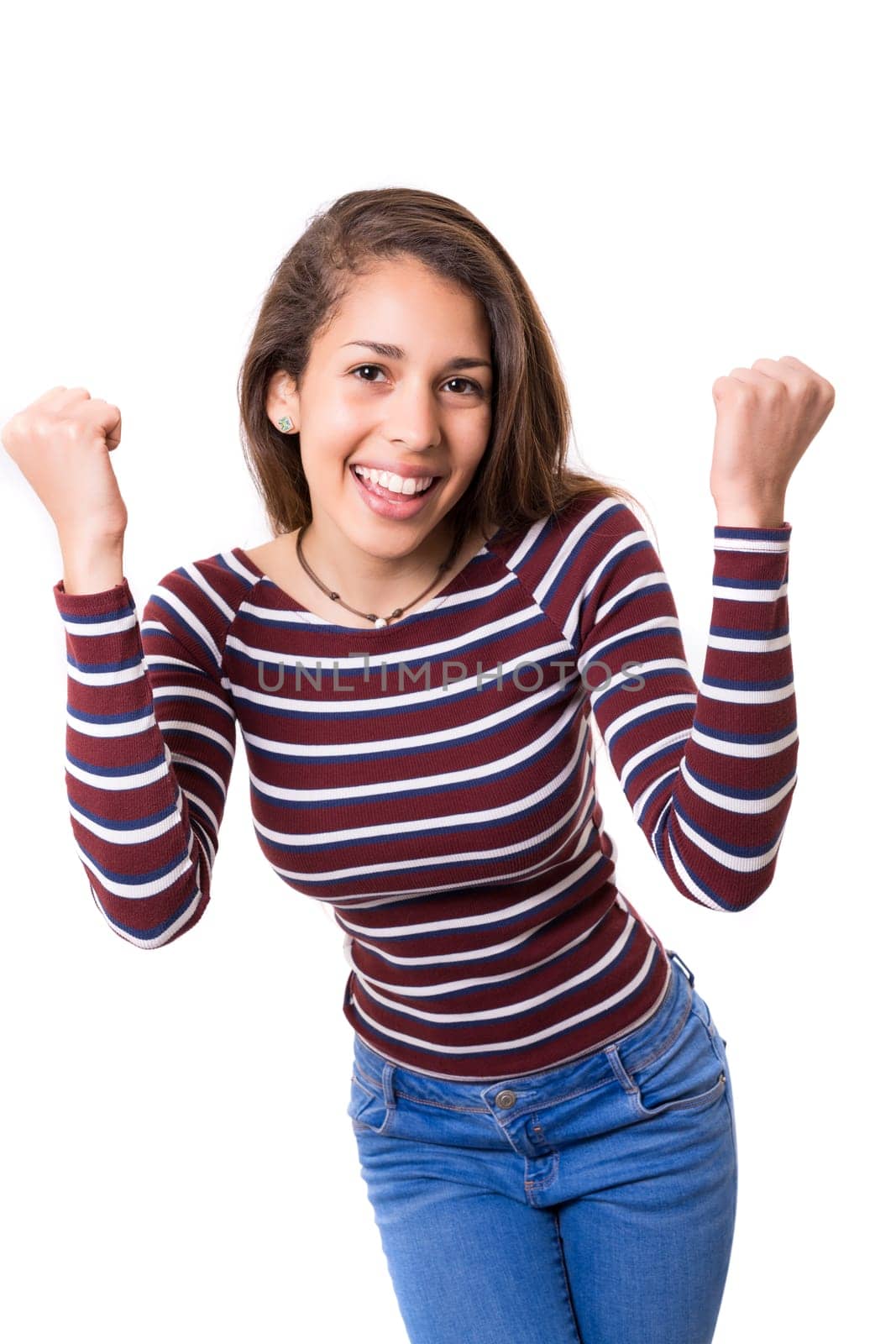 Studio shot: Happy woman with raised arms