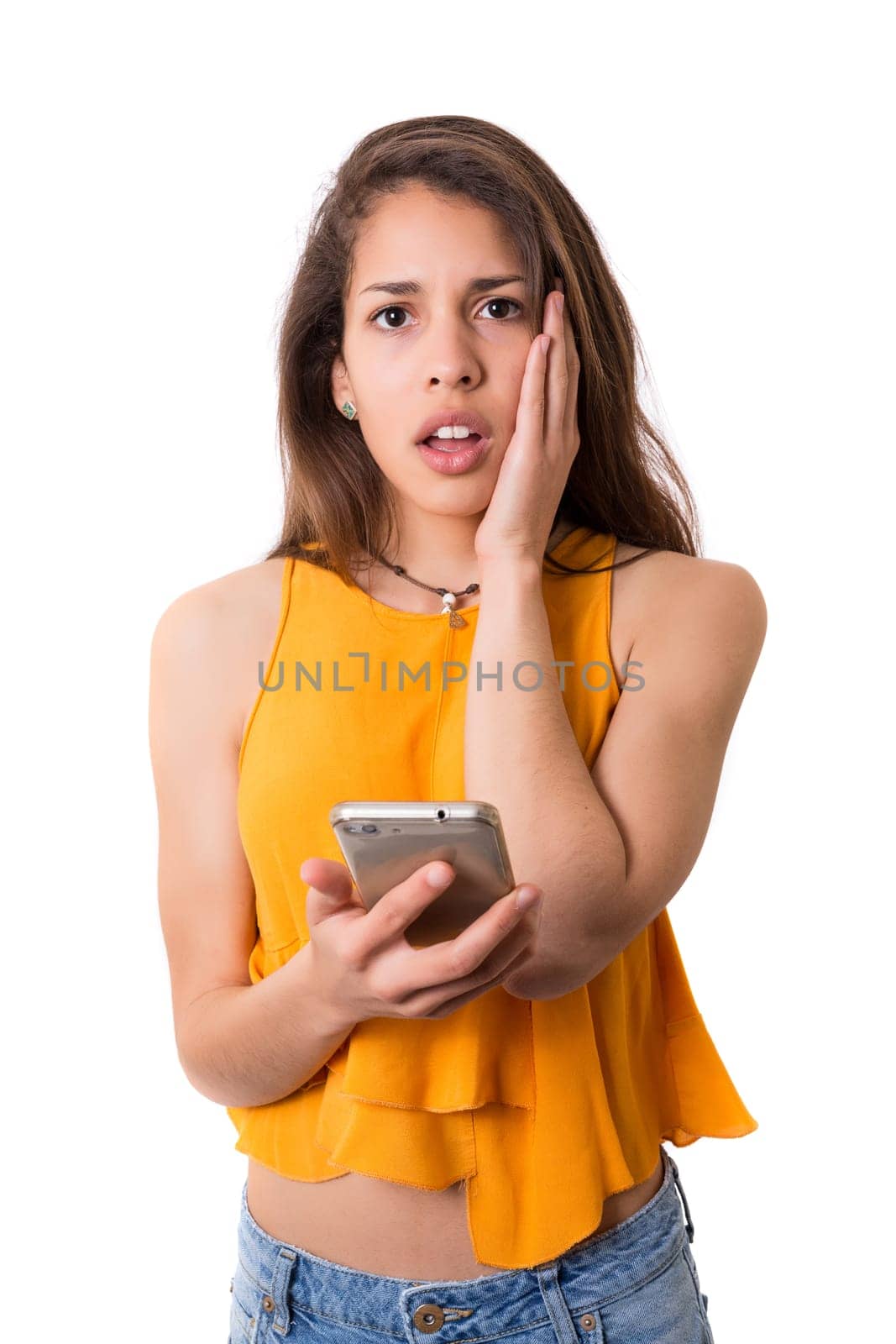 Young beautiful woman at the phone, isolated over a white background