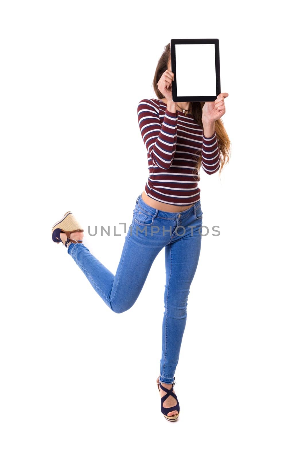 Happy young woman presenting your product in a tablet computer