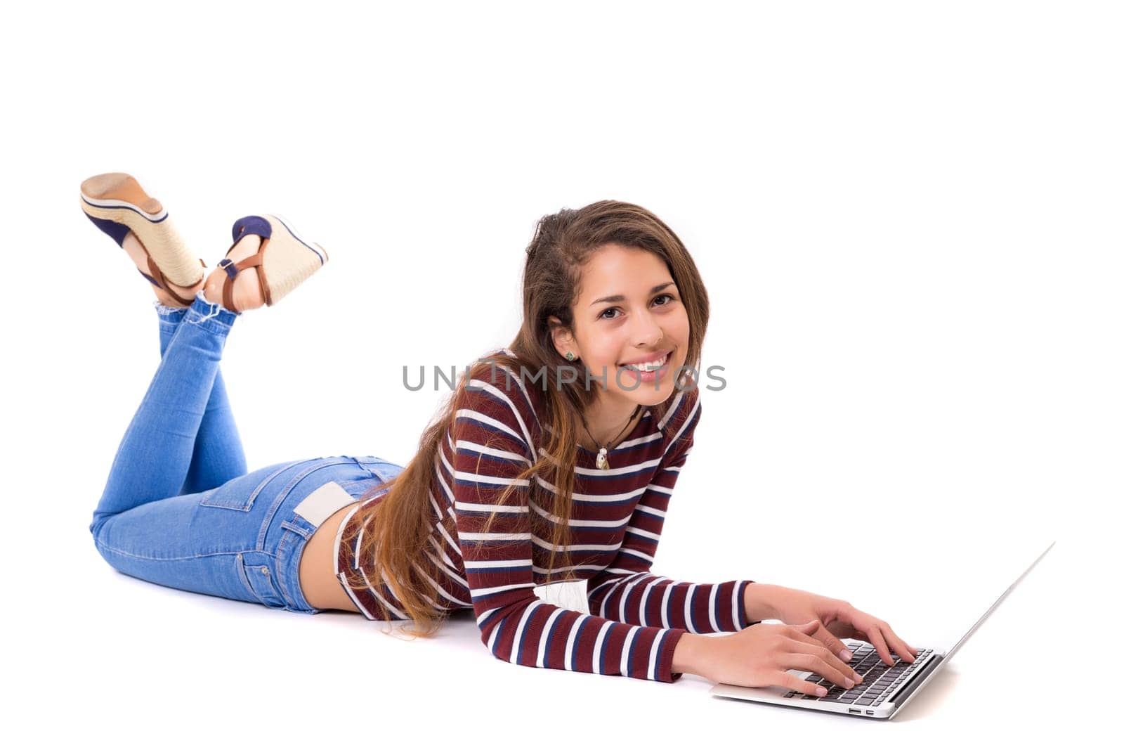 Young student working with her laptop, isolated over a white background