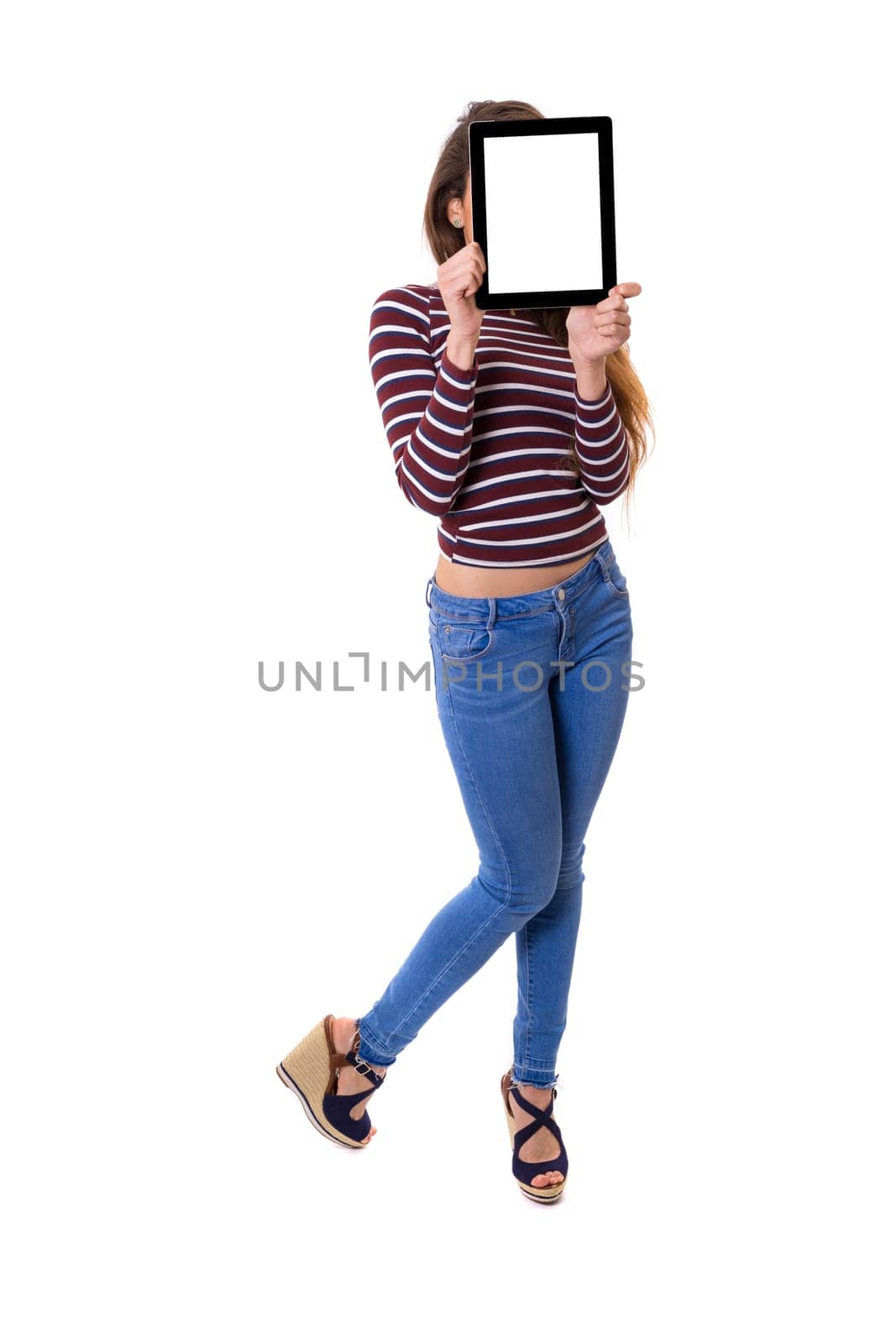Happy young woman presenting your product in a tablet computer