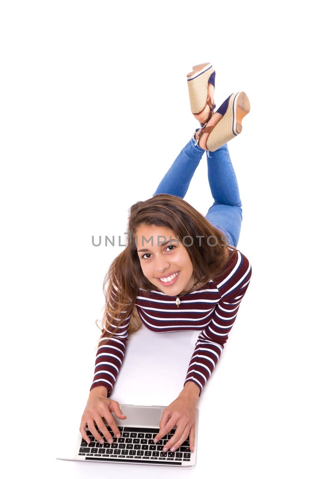 Young student working with her laptop, isolated over a white background