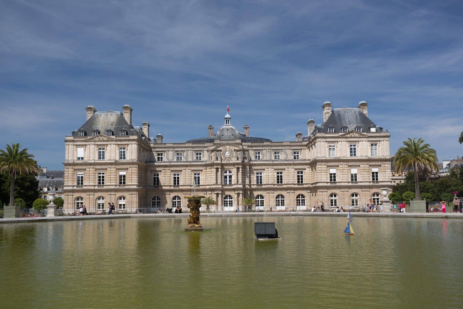 PARIS - AUGUST 13: Children's ships in fountain near Luxembourg Palace in the Luxembourg Garden on August 13, 2016 in Paris, France. Toy ships is most popular entertainment on Luxembourg Garden.