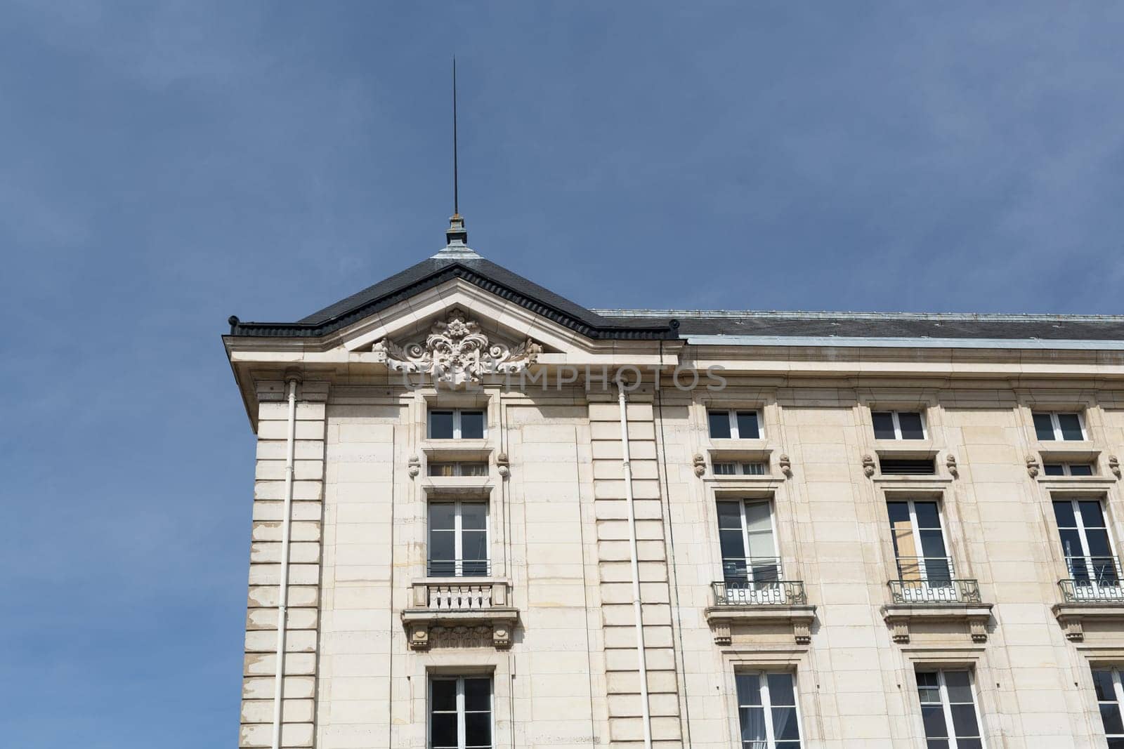 Facade of a traditional living building in Paris, France