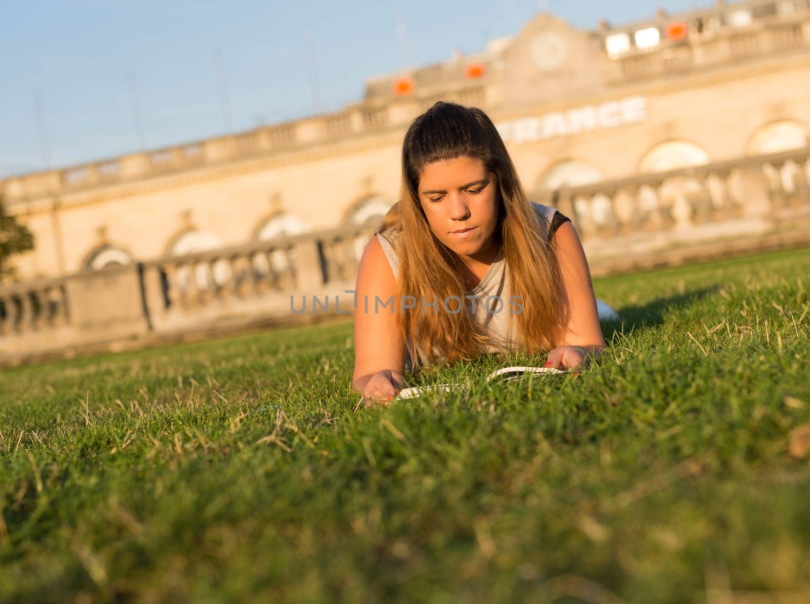 Lucky girl relaxing in the gardens next to the Invalides and the Alexander the 3rd bridge in Paris