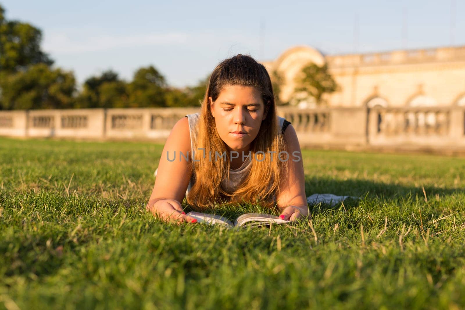 Lucky girl relaxing in the gardens next to the Invalides and the Alexander the 3rd bridge in Paris