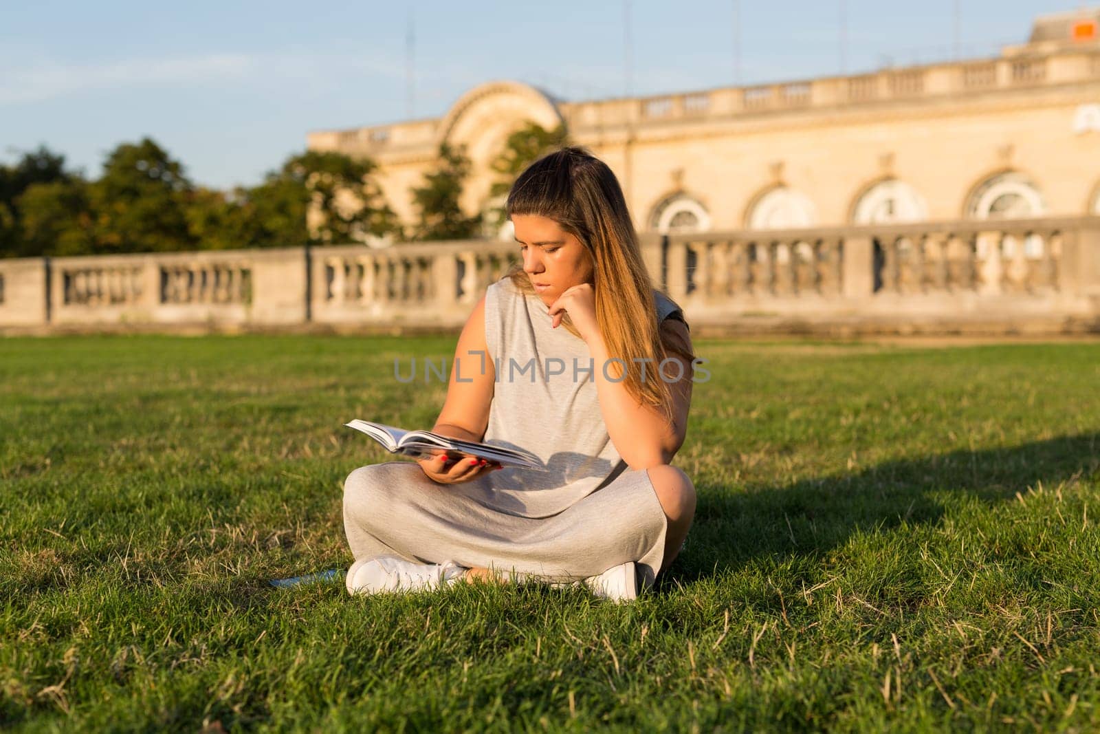 Lucky girl relaxing in the gardens next to the Invalides and the Alexander the 3rd bridge in Paris