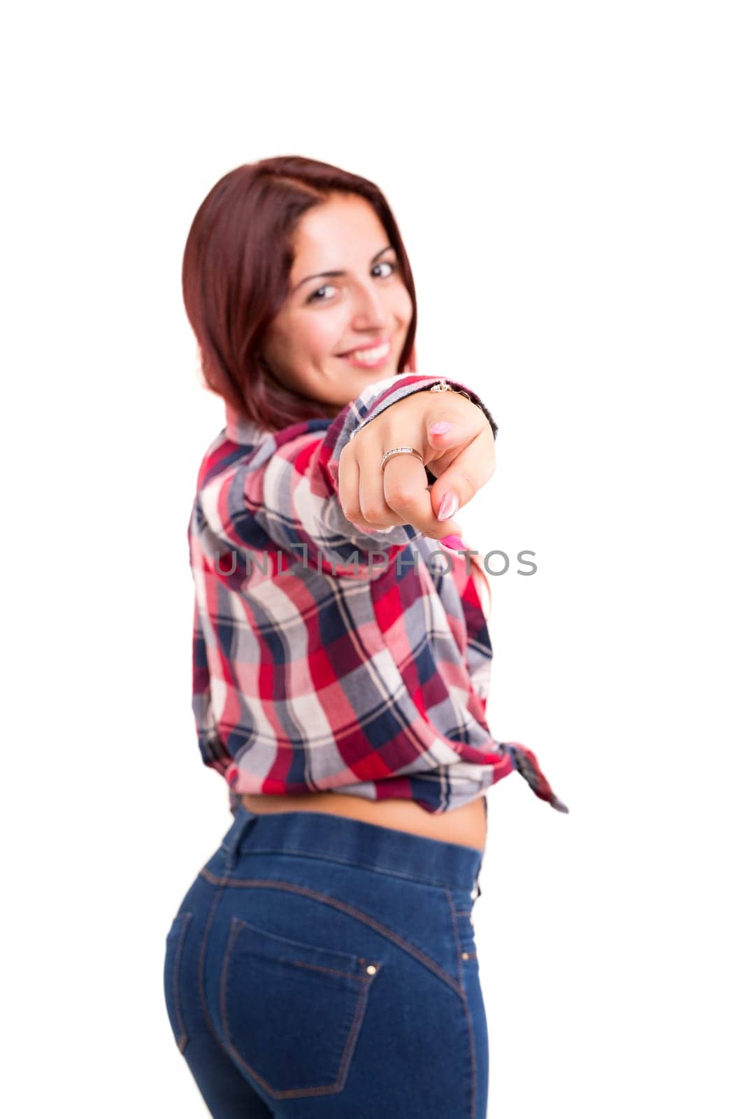 Young beautiful woman pointing at you, isolated over white