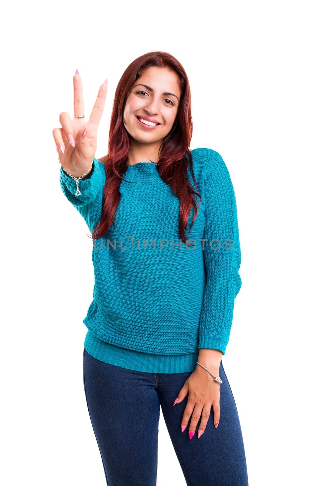 Beautiful young woman signaling ok, isolated over white