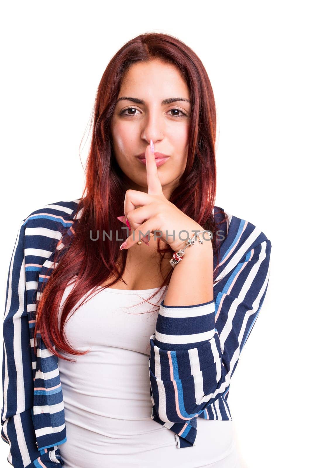 Beautiful young woman asking for silence isolated