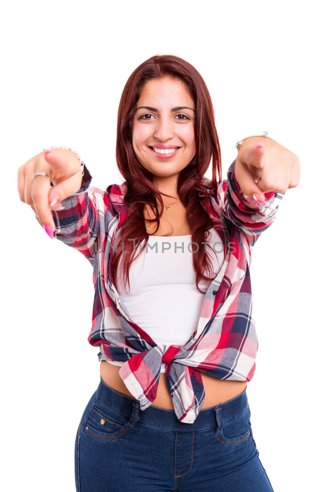 Young beautiful woman pointing at you, isolated over white