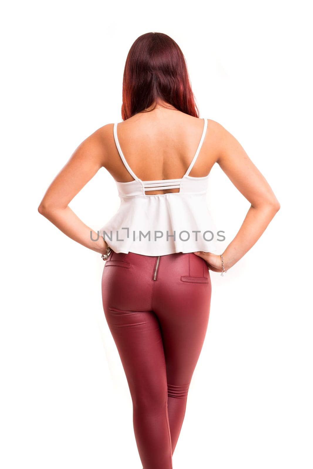 Woman posing with her back faced to camera, isolated over copy space background