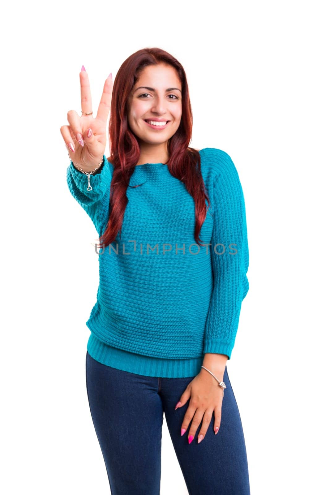 Beautiful young woman signaling ok, isolated over white