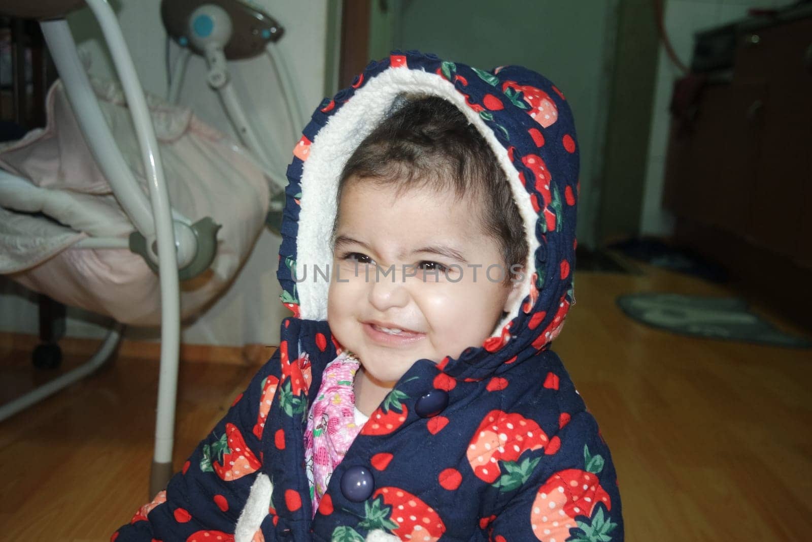Portrait of a baby girl with smiling face, big eyes and lovely face gesture