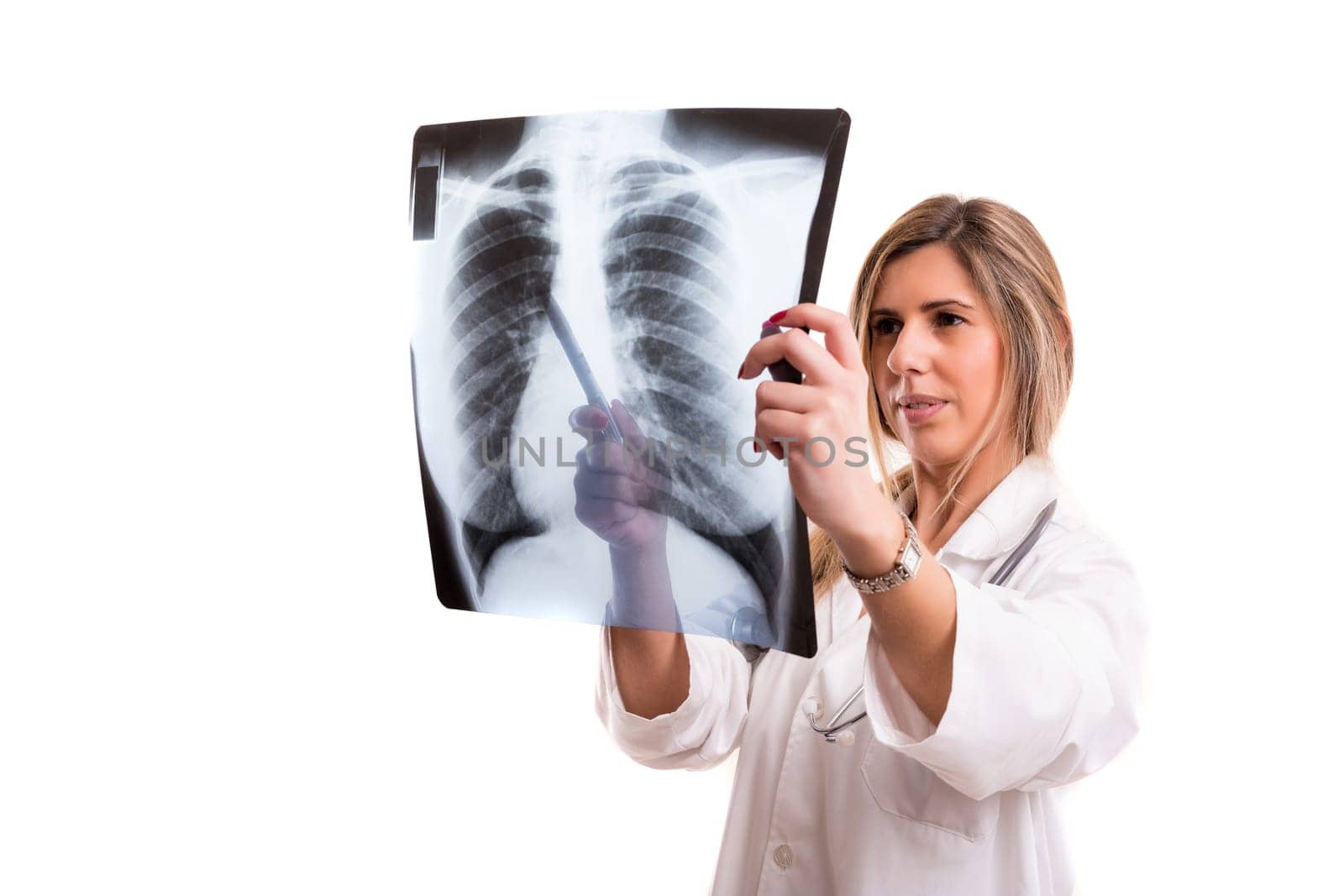Beautiful young doctor looking at some exams, isolated over white