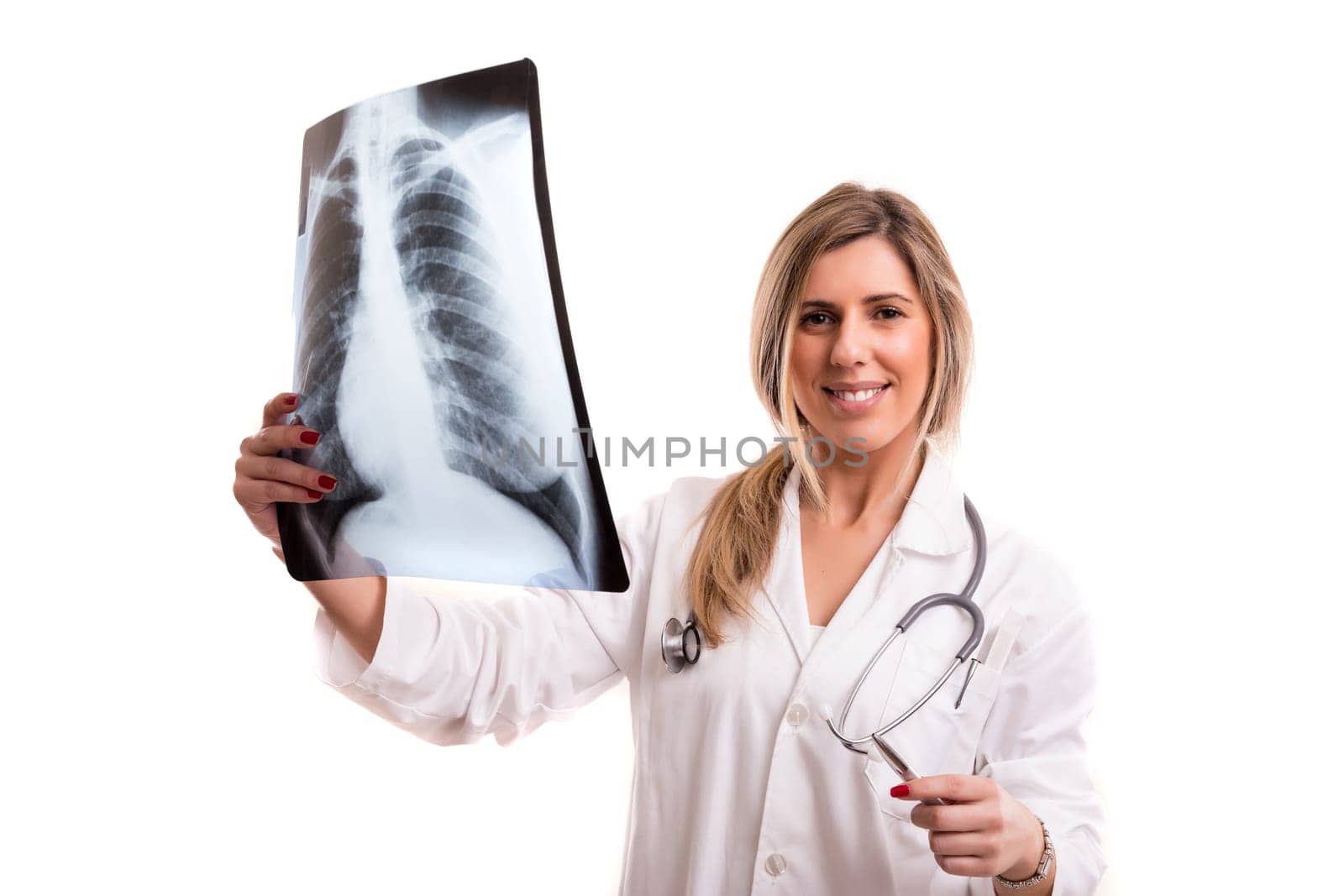 Beautiful young doctor looking at some exams, isolated over white