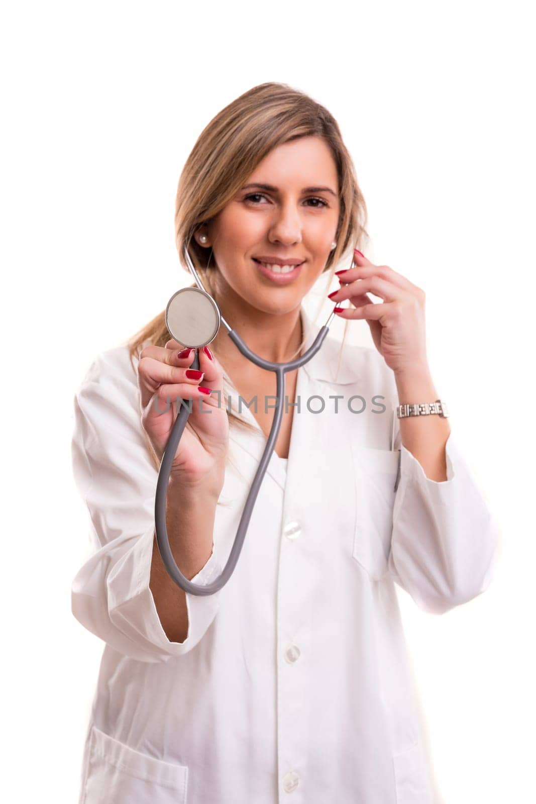 Young doctor holding stethoscope - isolated over white