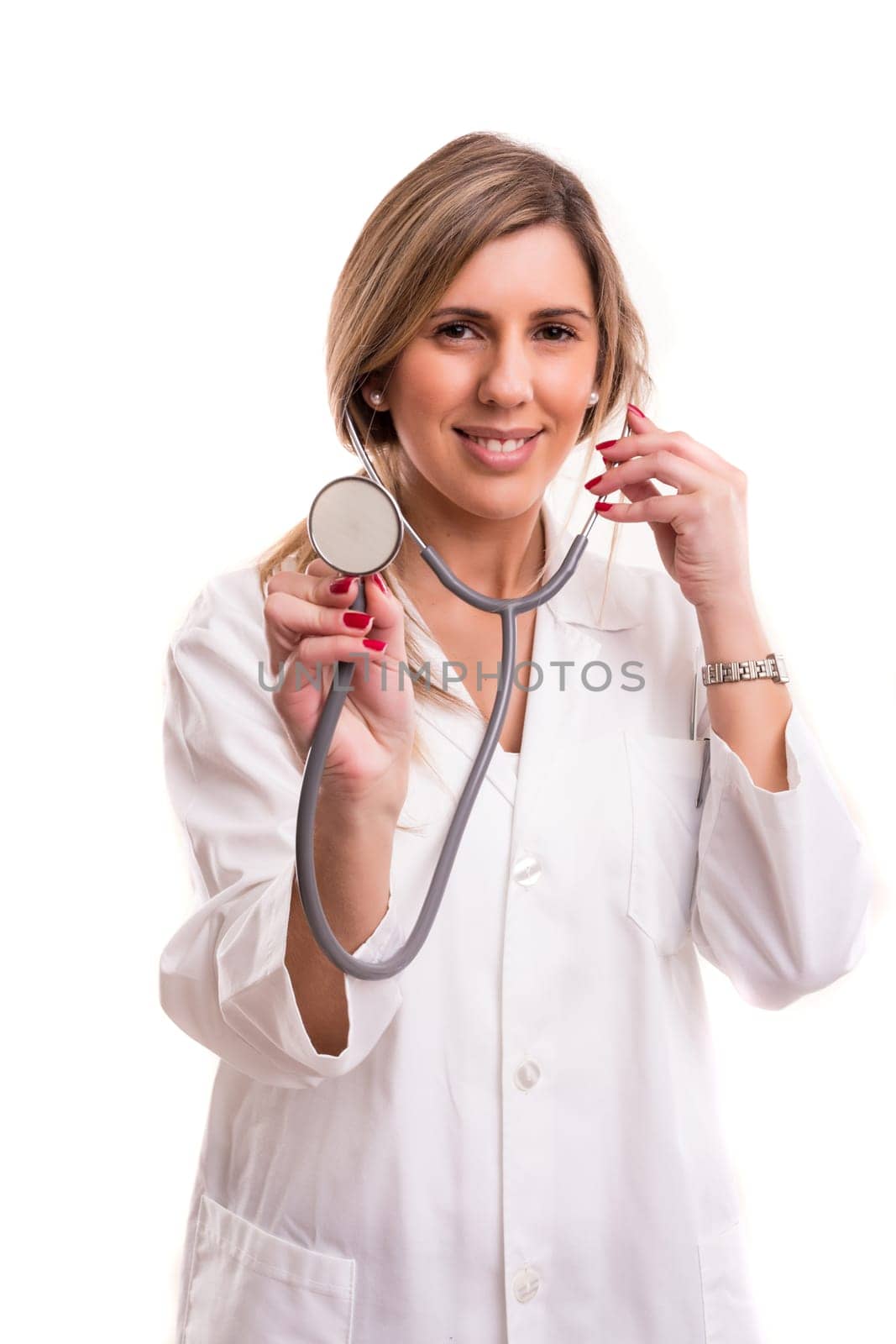 Young doctor holding stethoscope - isolated over white