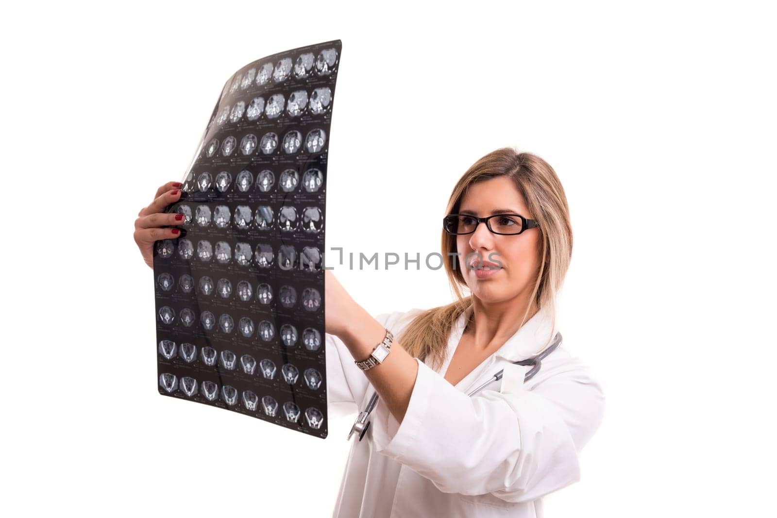 Beautiful young doctor looking at some exams, isolated over white