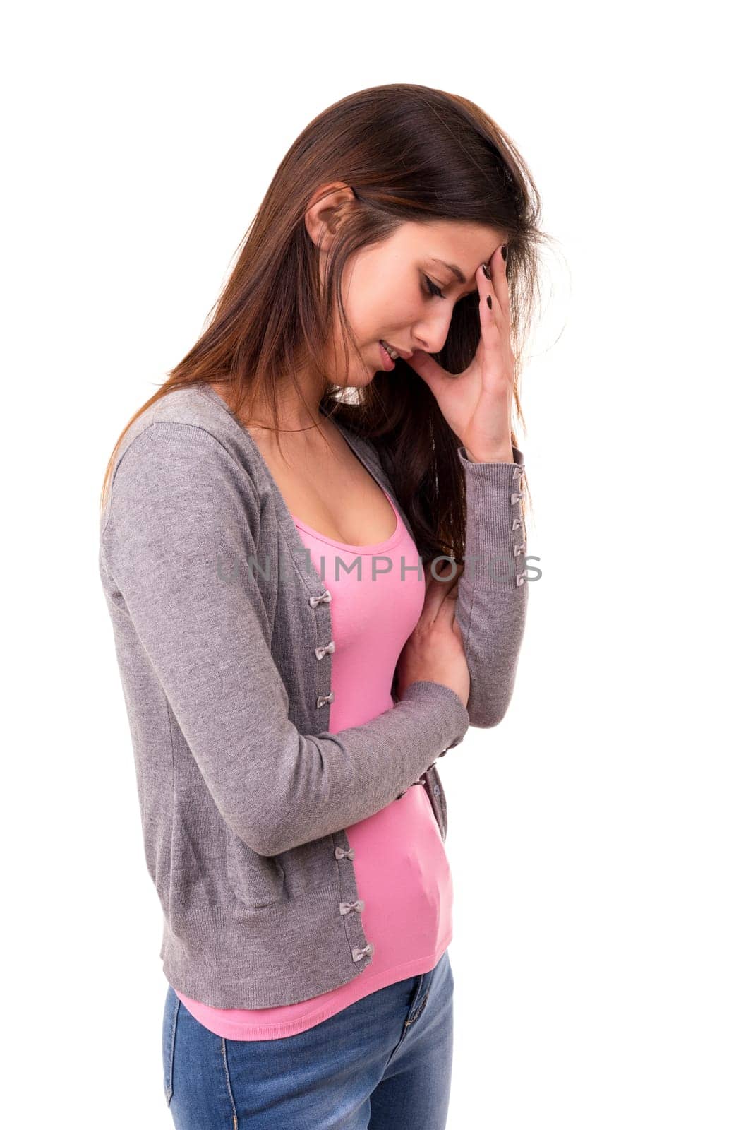 Young student tired of studying for the final exams, isolated over a white background