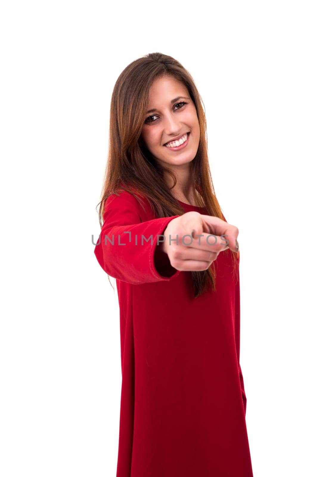 Young beautiful woman pointing at you, isolated over white