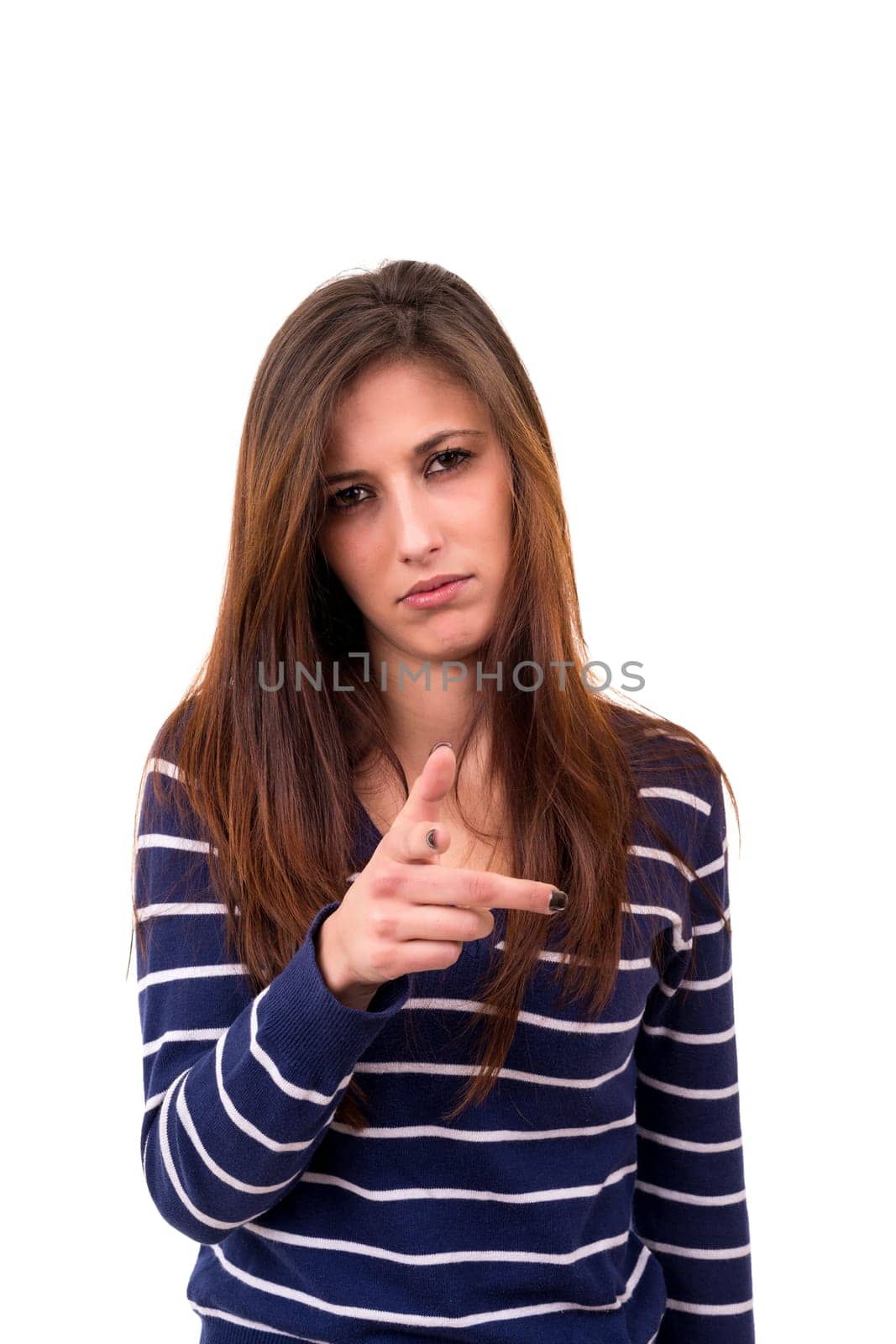 Studio shot of a young woman signaling thumbs down