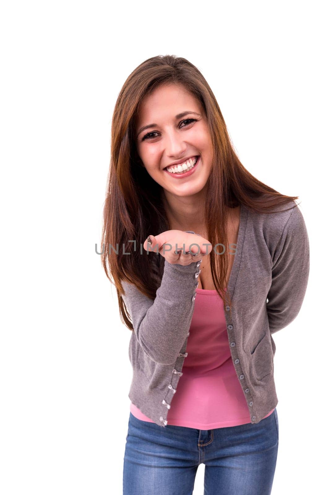 Beautiful young woman blowing you a kiss, isolated over white