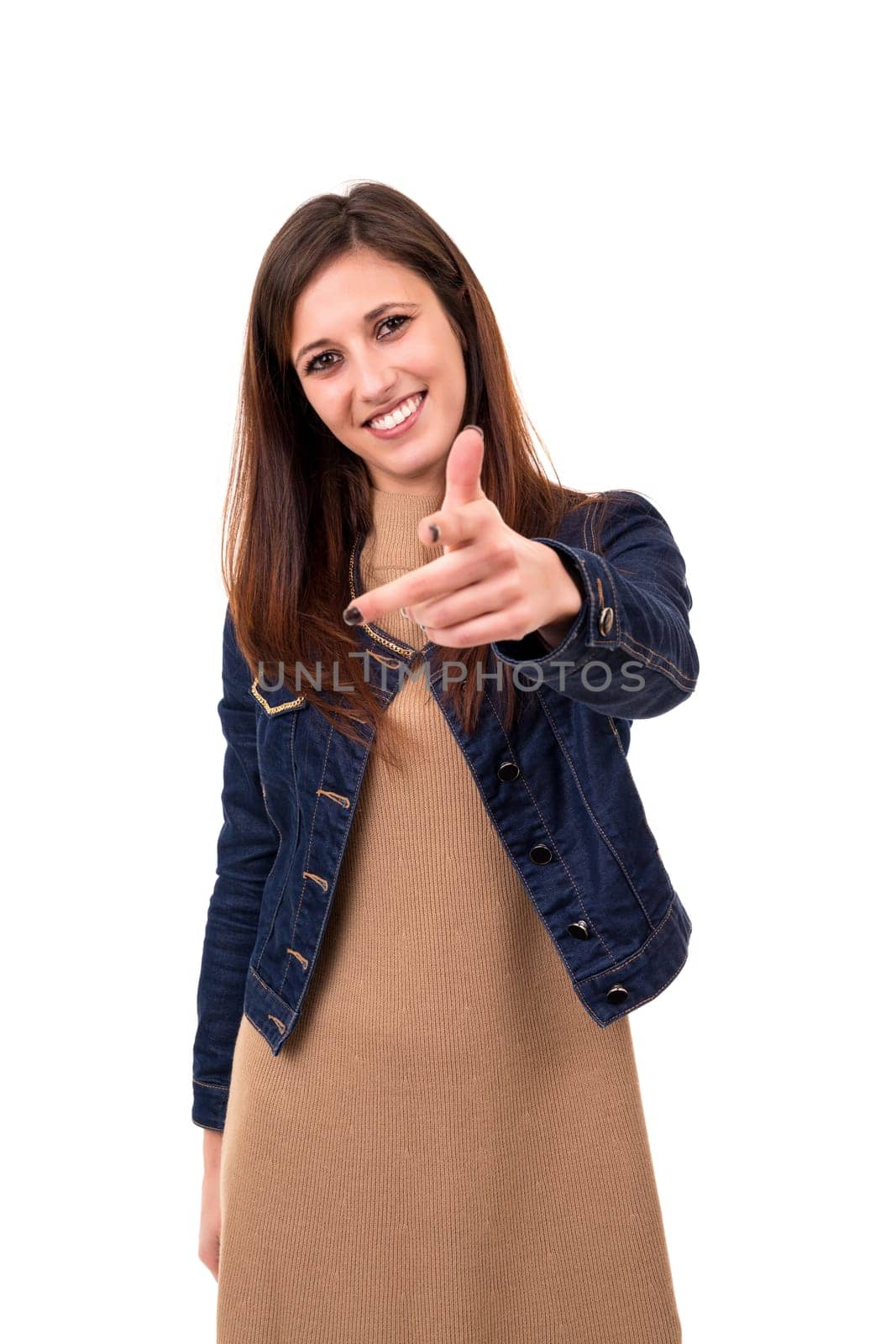 Young beautiful woman pointing at you, isolated over white